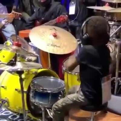 Young boy goes off on a drum solo