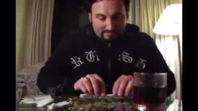 Julian tries rolling a six paper joint for himself.
