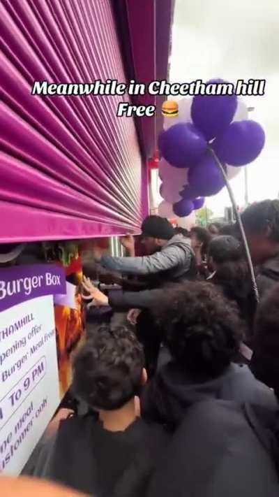 Outside a burger shop in the UK after they announced free burgers on their grand opening