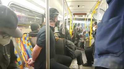 Dude films the inside of a bus full of rioters in plastic handcuffs including himself who were taken in by police and brought to a building with a bunch of other rioters in Los Angeles