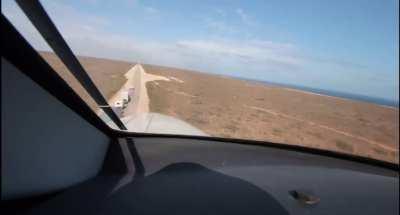 The Royal Flying Doctor Service landing on an emergency road strip on the Nullarbor Plain. The patient, injured in a crash, was flown 1000km to Adelaide, the closest place with a major hospital. No cost to the patient.