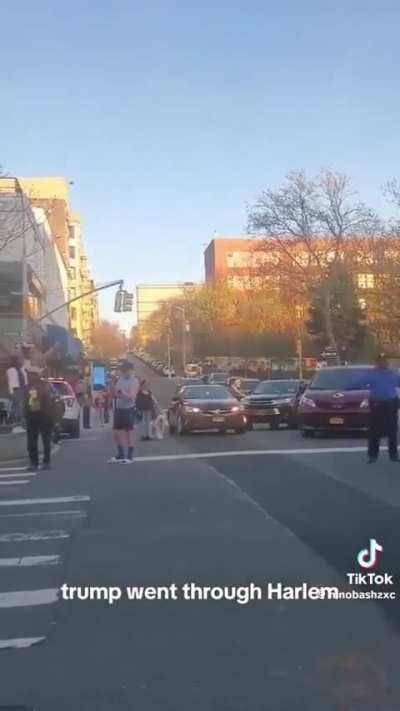 Trump is driven through Harlem