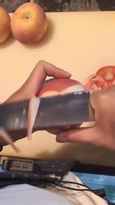 Peeling an apple with a knife