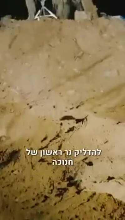 IDF lighting the first Hannukah candle in Gaza square