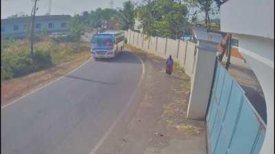 Rider on scooter narrowly misses a bus