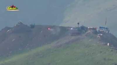 Kurdish fighters firing an atgm at Turkish position (pretty sure it's a tank, can't say for sure)