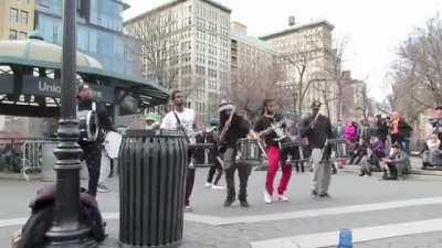 Drugged up kid kicks the tip jar of a percussion ensemble in New York