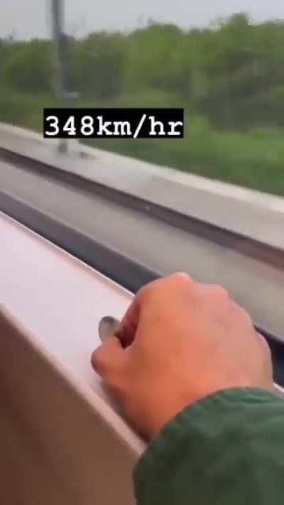 Train traveling at 348 km/h (216 mph) without vibration