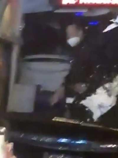 Diego Simeone taunting a crowd of Real Sociedad fans as they attack the Atletico Madrid team bus