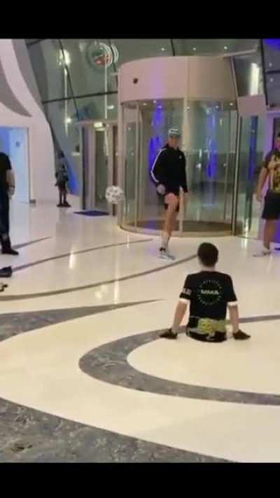 Cristiano Ronaldo shows his caring side as he plays football with a boy born without legs