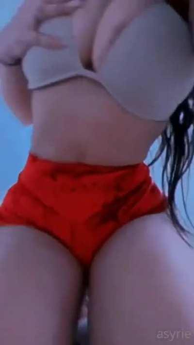 Her bra can barely hold her boobs