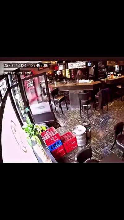 Lady falls into a hole while entering a café. Belgium