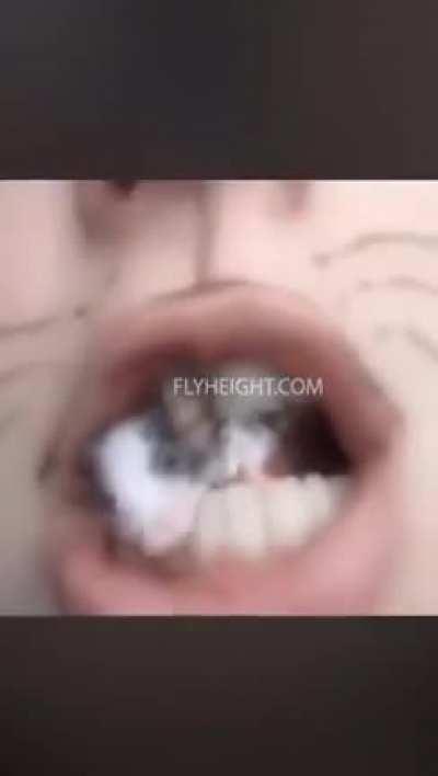 Crazy lady eats a live mouse