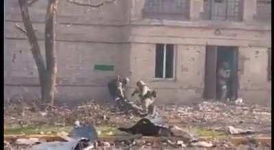 Video of street fighting in the Azovstal area. Russian infantry cross a street, taking fire and a casualty in the process.