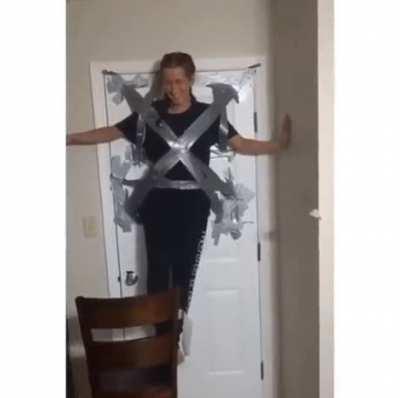 Duct taping yourself to the wall.