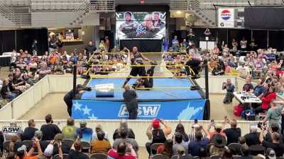 Angelina Love and her male partner receive a flying headbutt (Different Angle)