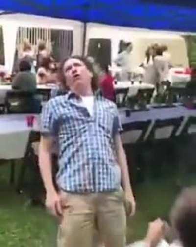 Man walks into swinging kid