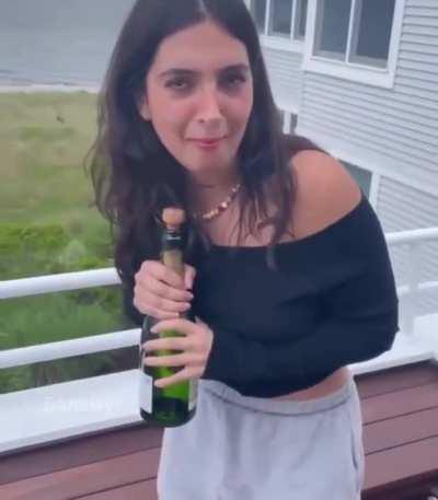 HMC while opening champagne.