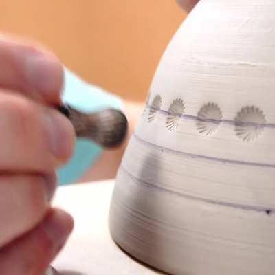 Laser guide used to throw a peacock eye bowl