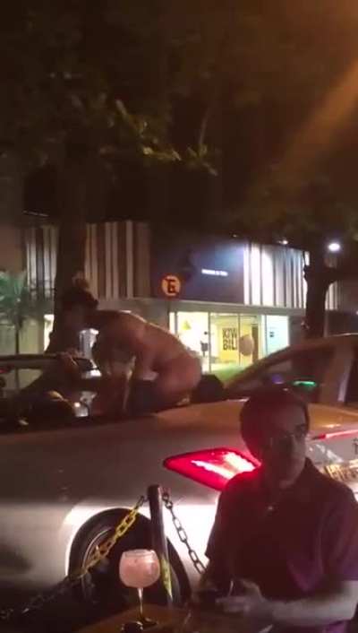 Throwing trash at a woman in a bikini