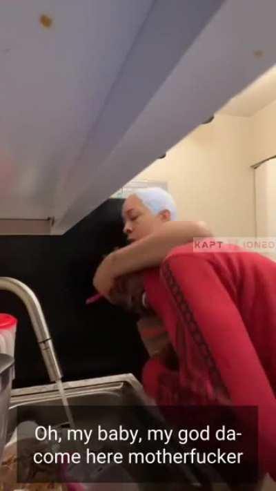 Never mess with a mom washing dishes