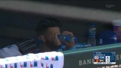 Lourdes Gurriel Jr having some fun with water bottles on the bench