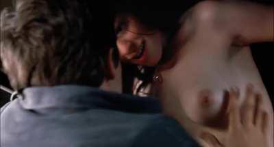 Anne Hathaway taking off her bra