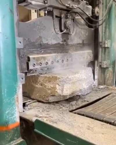 A stone-cutting machine in action.