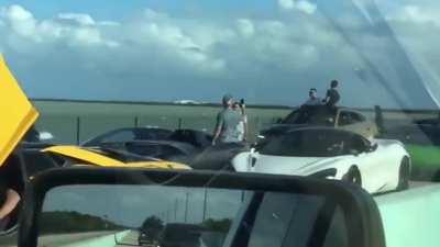 Rich kids illegally blocking the road with supercars to take pics