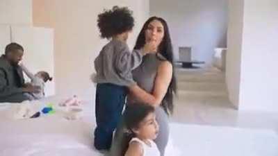 Kanye eating baby hands and not paying attention, a certified cute parent moment for sure <3