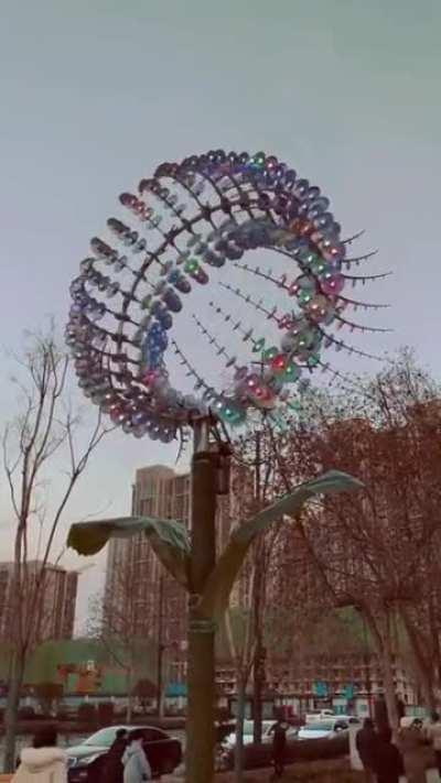 This kinetic sculpture on the sidewalk