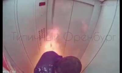 Guy checks if his vodka is flammable in an elevator