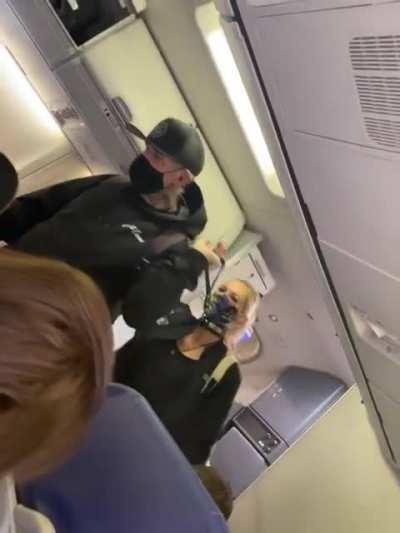 Walking your partner on a leash while boarding a plane