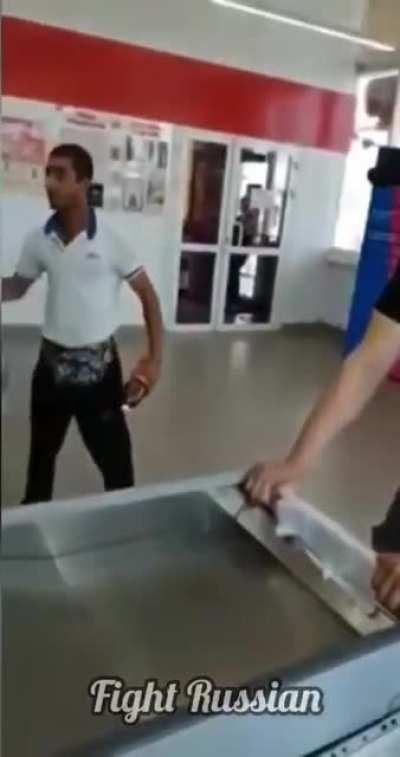 Unsatisfied customer, shouting at the supermarket. and tries to pick a fight with one of the workers