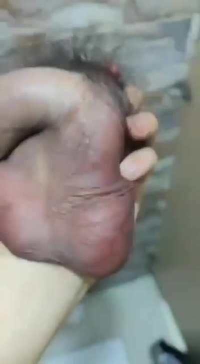 Woman holding a severed penis.