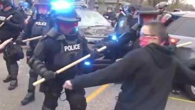 BLM protester shot in the head with a rubber bullet right after picking up some concrete