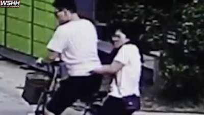 Guy kick kid because he hit his girlfriend with a football!