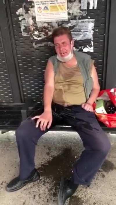 (NSFW) Drunk Guy pissing at bus station