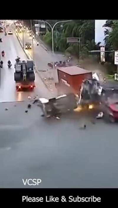 Truck crashes into traffic after possible brake failure.