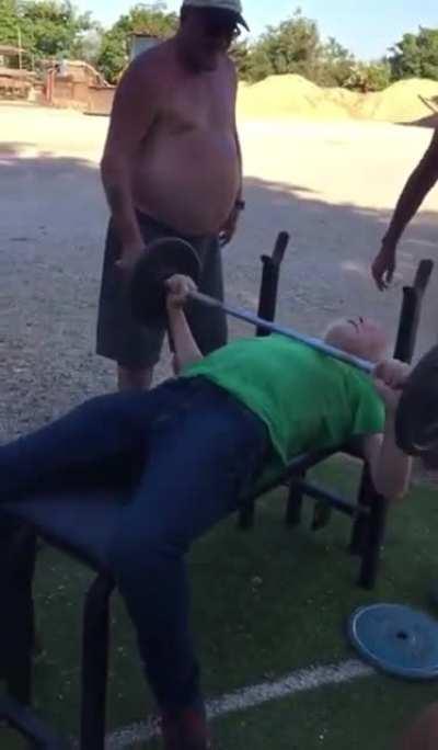 Messing with a man while he bench presses
