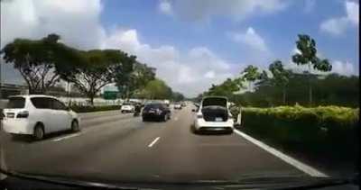 bike rear ends a stopped car on the highway