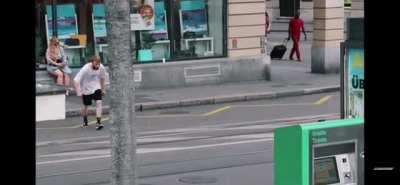 man jumping over wall into water.