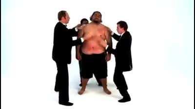 man with heavy bones being used as an instrument by 3 men