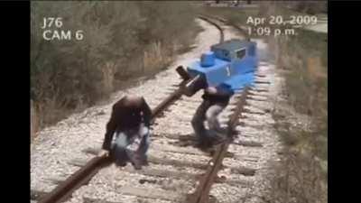 Guy gets hit by train! (GRAPHIC)