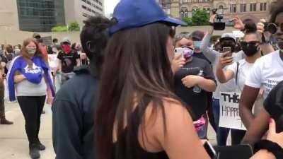 Man in black face showed up to the Toronto protest. He was later arrested.