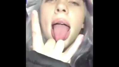 Sticking her tongue all the way out 👅