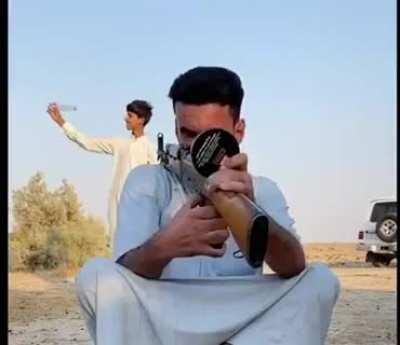 Open a bottle of water by AK-47.