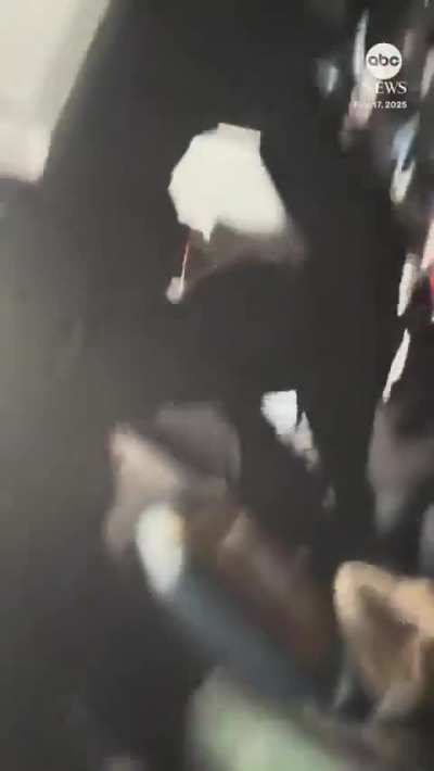 Survivors of Delta plane crash hanging upside down in the seats of overturned aircraft