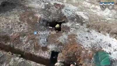 Drone supported infantry clearing trenches and dugouts.