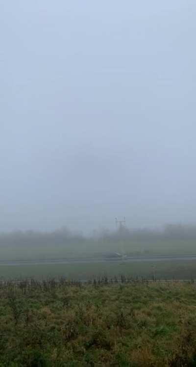 Boeing 747 low fly-by during heavy fog.